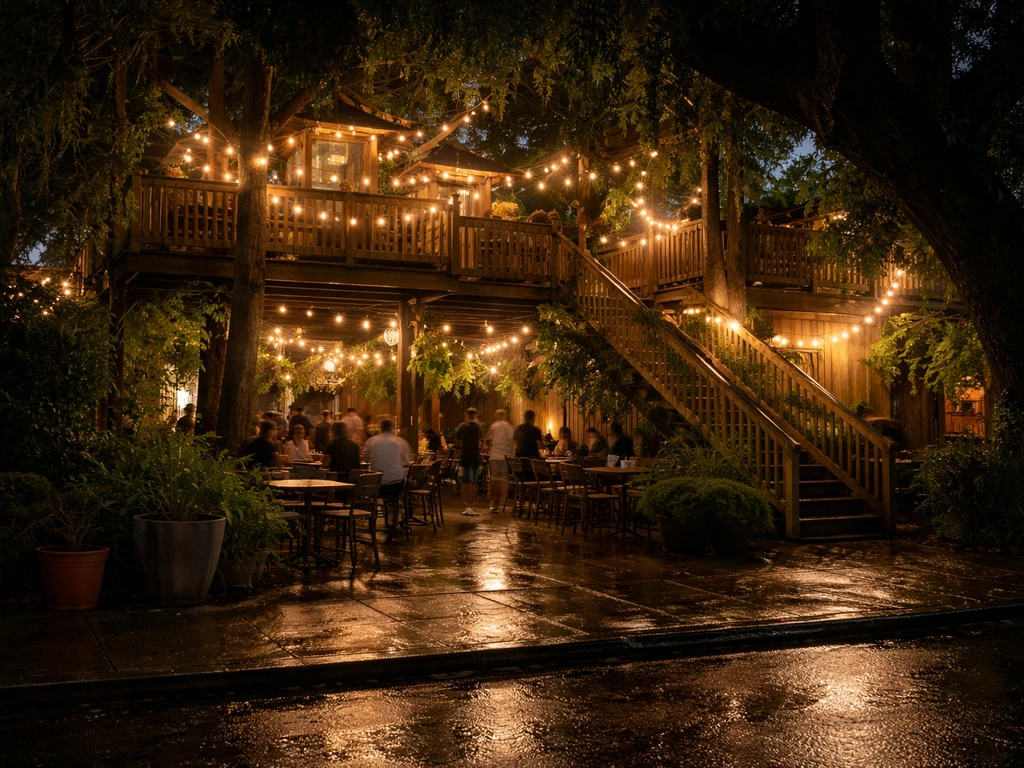 Warmly lit multi-level treehouse patio bar at night with string lights and a lively bayou vibe.