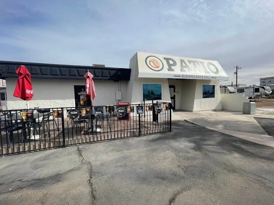 Exterior view of Patio Susheria Bar & Grill in Yuma with patio seating and storefront signage.