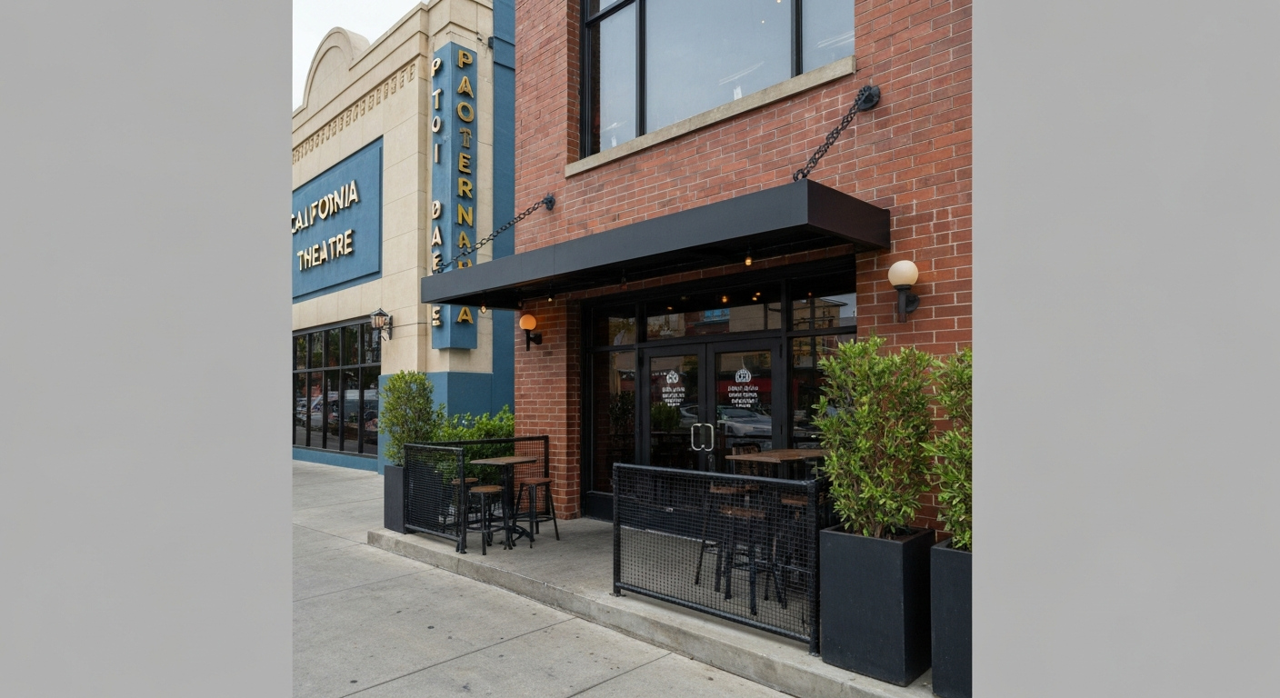Exterior view of The Continental Bar Lounge & Patio in San Jose's SoFA district, showing the patio entrance and neighboring California Theatre.